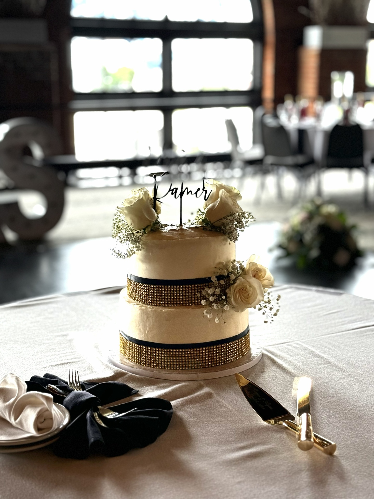 Two-tier wedding cake with white roses